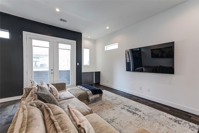 living room with french doors and dark hardwood / wood-style floors