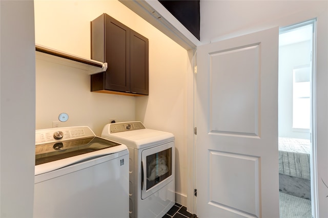 laundry room with carpet flooring, washer and dryer, and cabinets