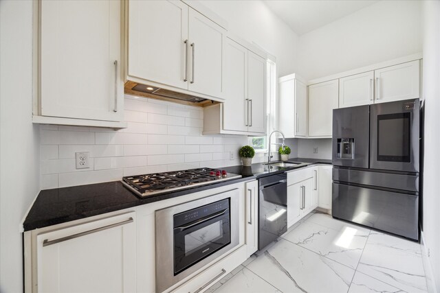 kitchen with black appliances, white cabinets, backsplash, sink, and light tile floors