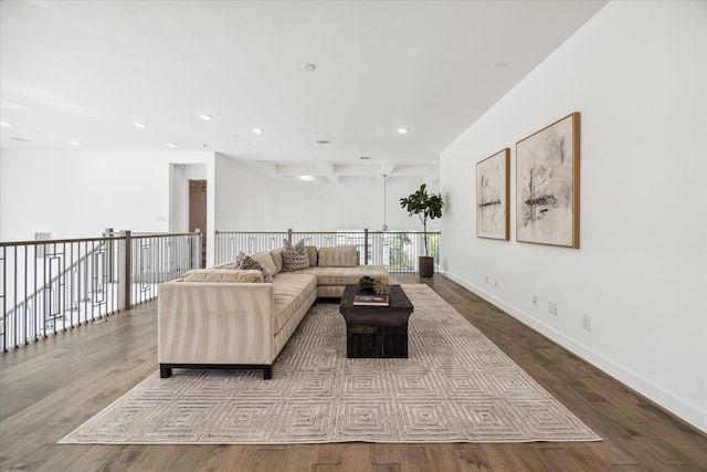 living room with beamed ceiling and hardwood / wood-style flooring