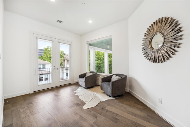 sitting room featuring french doors and dark hardwood / wood-style floors