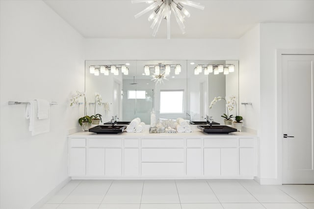 bathroom featuring a notable chandelier, tile flooring, and double vanity