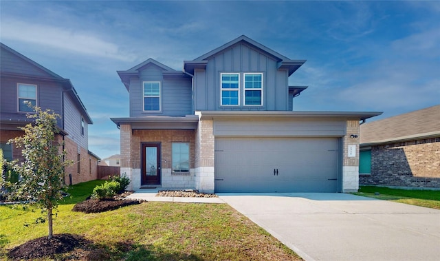 view of front of property featuring a garage and a front yard