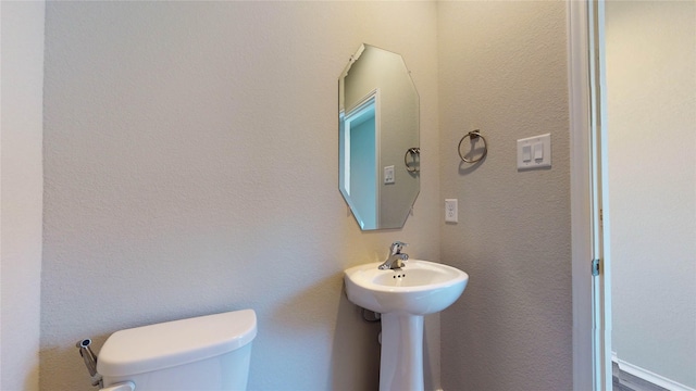 bathroom featuring toilet