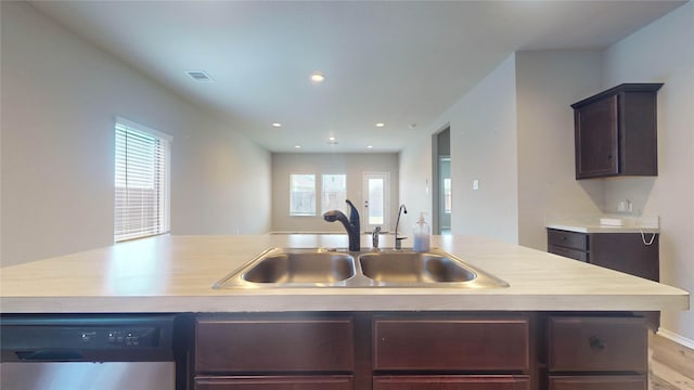 kitchen featuring dishwasher, light hardwood / wood-style floors, plenty of natural light, and sink