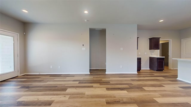 unfurnished room with light hardwood / wood-style flooring