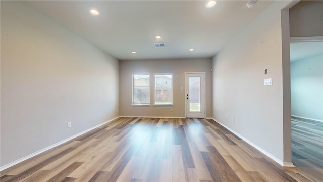 unfurnished room featuring light hardwood / wood-style flooring