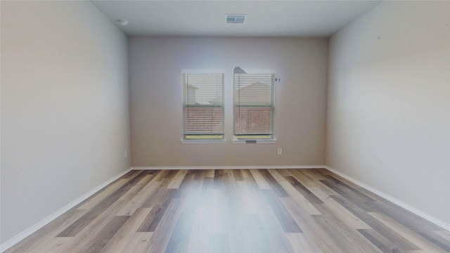 unfurnished room featuring light hardwood / wood-style flooring