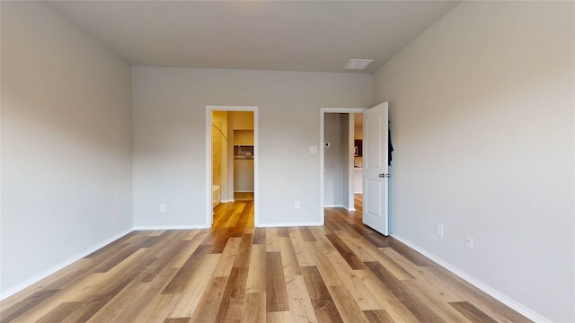 unfurnished bedroom with light wood-type flooring