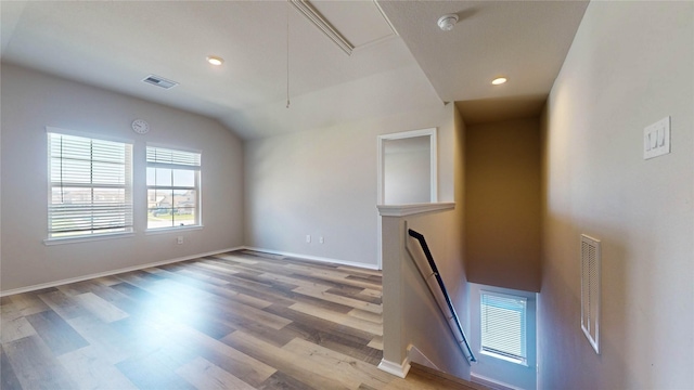 interior space with lofted ceiling and hardwood / wood-style flooring