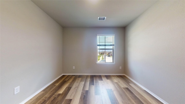 empty room featuring hardwood / wood-style floors