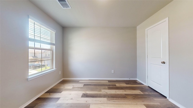 empty room featuring hardwood / wood-style floors