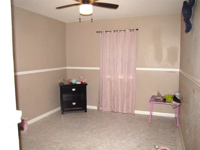 recreation room featuring tile flooring and ceiling fan