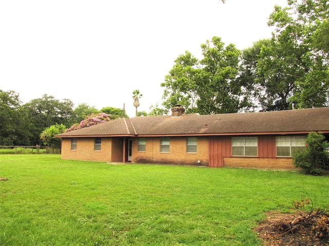 20002 Fm 1488th Rd, Magnolia, TX 77355 - view of front of house with a chimney, a front yard, and brick siding