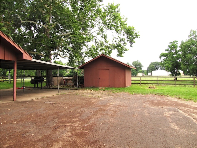 exterior space with a shed and a carport