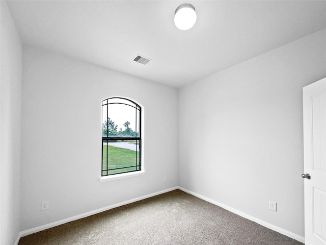 unfurnished room with carpet floors