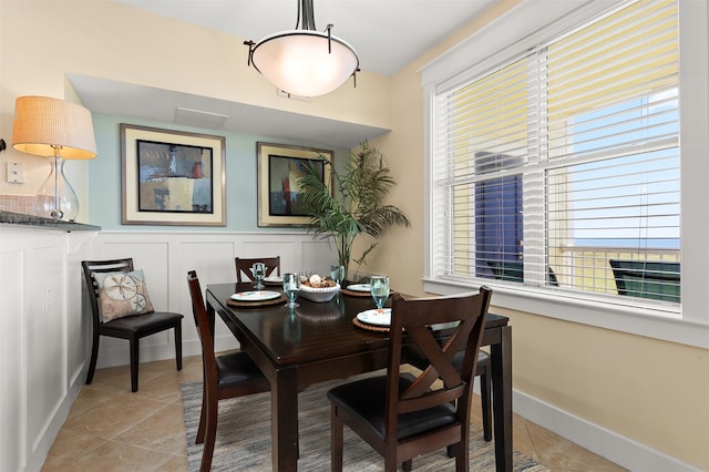 dining room featuring light tile flooring