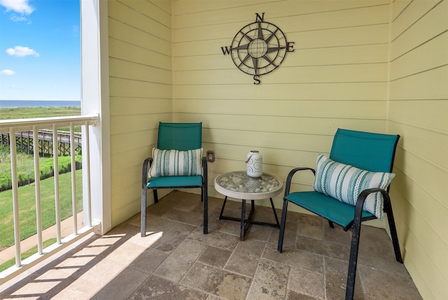 balcony featuring a water view