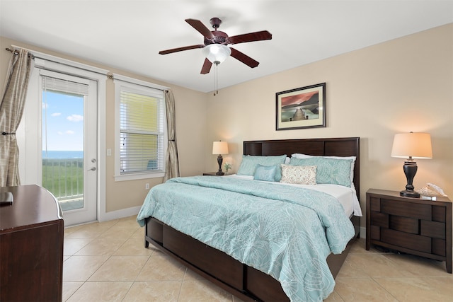 bedroom featuring ceiling fan, light tile floors, and access to exterior