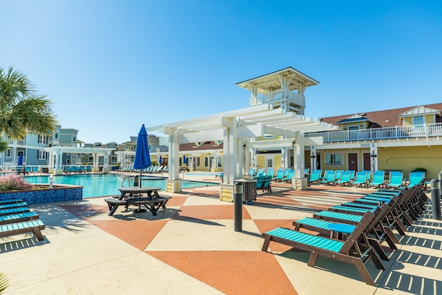 exterior space featuring a pergola and a pool