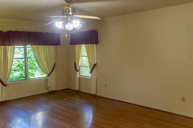 spare room with hardwood / wood-style flooring and ceiling fan