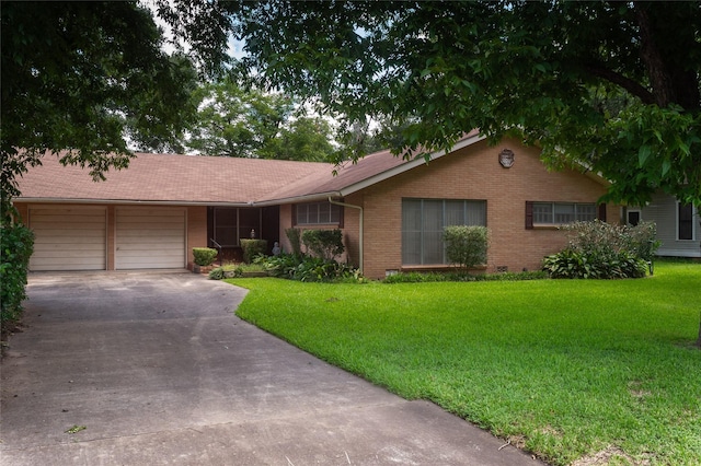 ranch-style home with a garage and a front yard