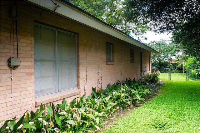 view of property exterior featuring a lawn