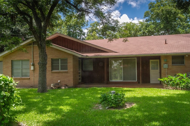 back of house with a yard