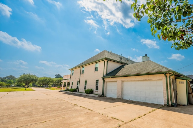 view of property exterior featuring a garage