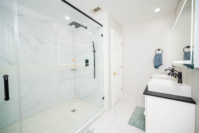 bathroom featuring vanity and a shower with door