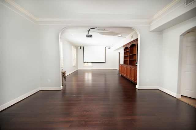 hallway with dark hardwood / wood-style floors and crown molding