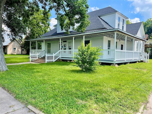 farmhouse-style home with covered porch and a front lawn