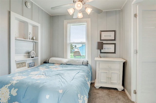 bedroom with ornamental molding, carpet flooring, and ceiling fan