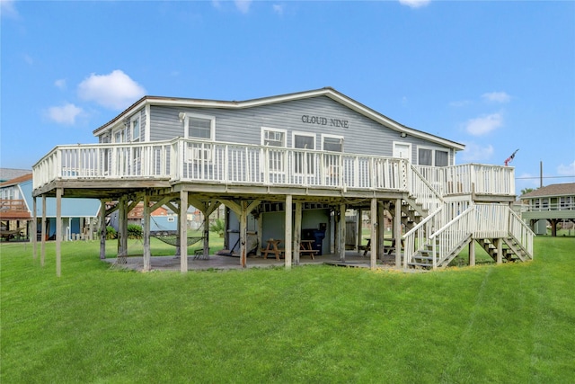 back of property with a wooden deck and a yard