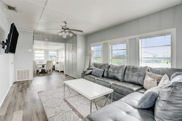 living room featuring hardwood / wood-style flooring and ceiling fan