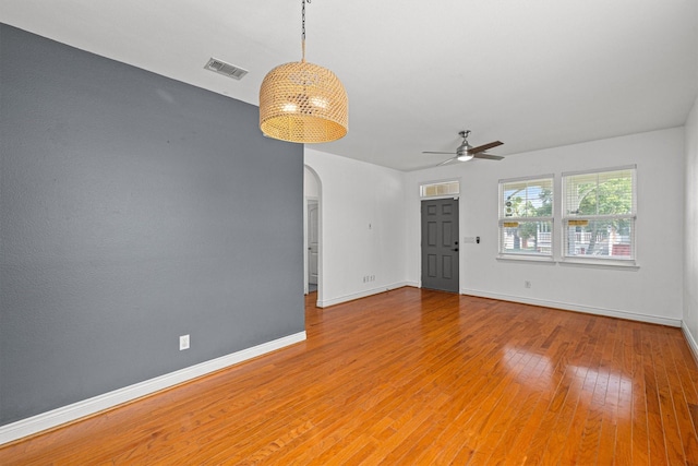 empty room featuring ceiling fan and light wood-type flooring