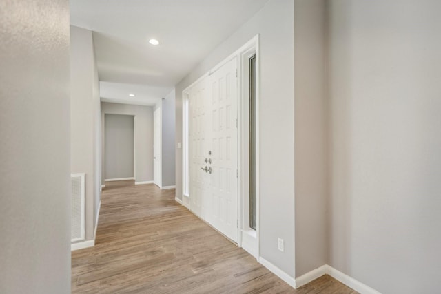 hall with light hardwood / wood-style floors