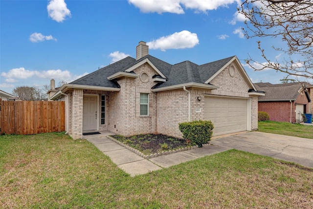 view of front of house with an attached garage, a front lawn, and roof with shingles