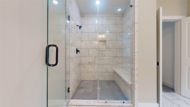 bathroom featuring an enclosed shower and tile flooring