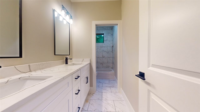 bathroom featuring tile floors, dual bowl vanity, and tiled shower / bath combo