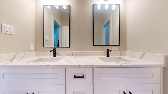 bathroom featuring dual vanity