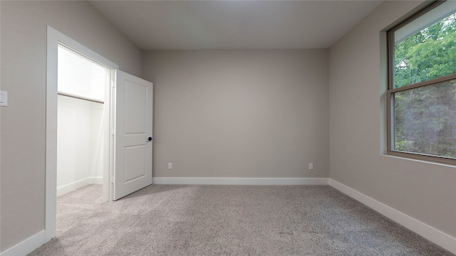 unfurnished bedroom featuring light colored carpet