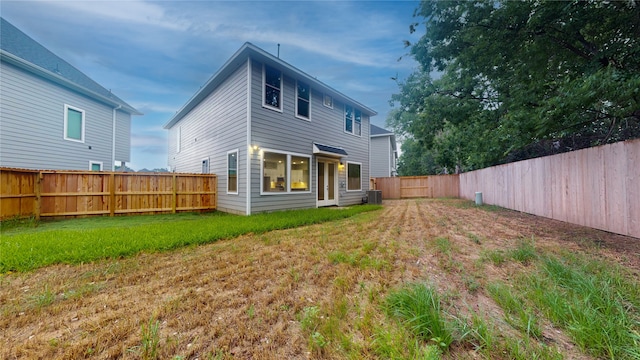 rear view of house with a lawn