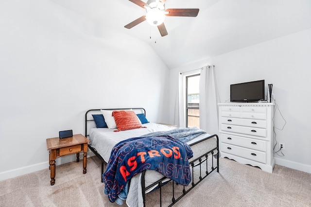 bedroom featuring ceiling fan, light carpet, and vaulted ceiling