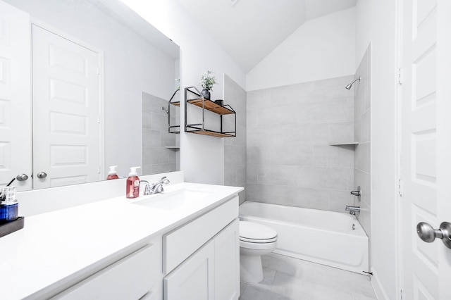 full bathroom featuring toilet, tiled shower / bath combo, tile patterned flooring, vaulted ceiling, and vanity