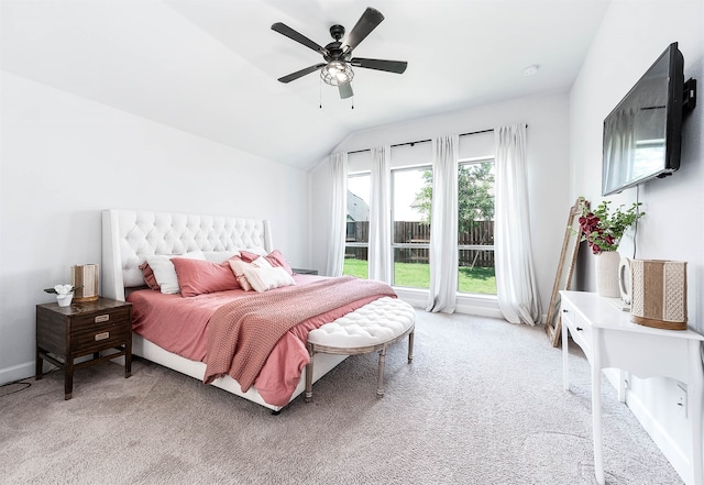 carpeted bedroom featuring ceiling fan and lofted ceiling