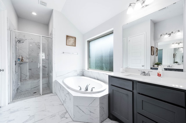 bathroom featuring independent shower and bath, lofted ceiling, and vanity