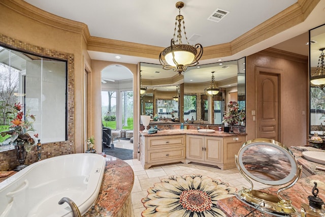 bathroom featuring vanity, ornamental molding, and tiled bath