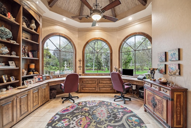 office space with beamed ceiling, crown molding, and built in desk