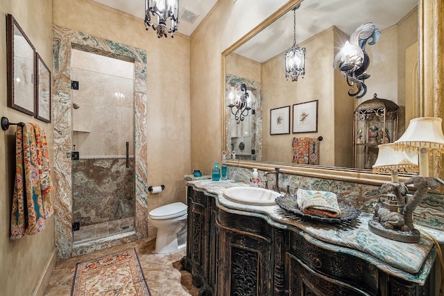 bathroom with vanity, toilet, a chandelier, and walk in shower